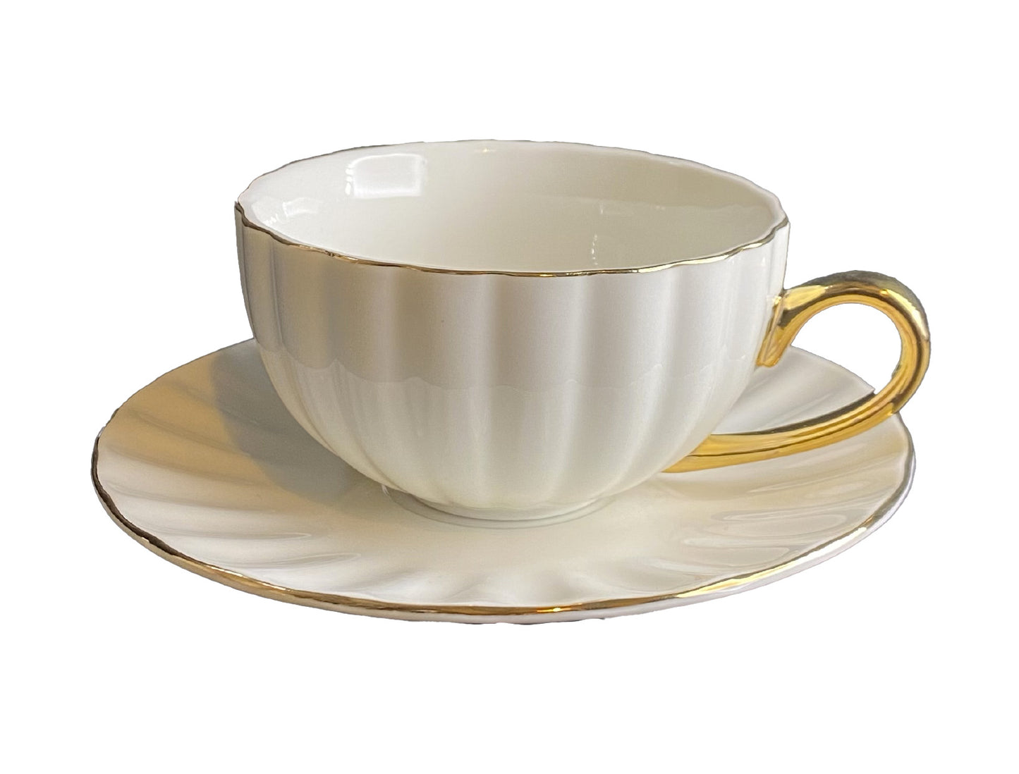 Tazza a "conchiglia" da The con piattino